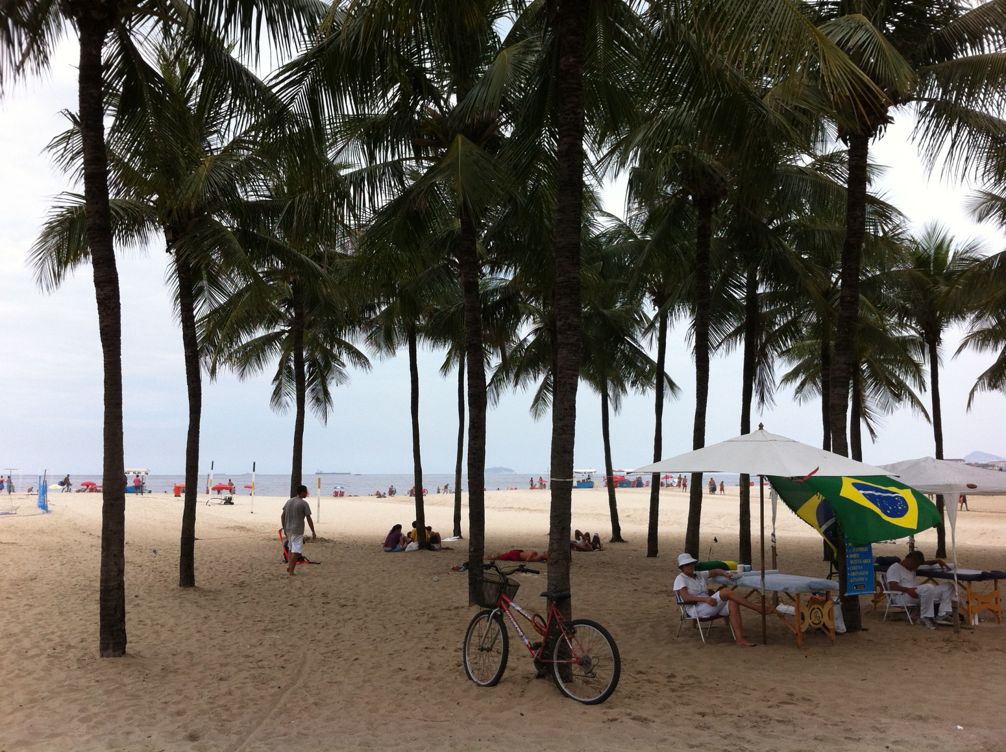 White sand and coconut trees of Copacabana, Brazil
