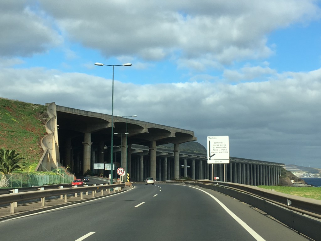 Driving below Funchal airport runway, Santana day trip from Funchal