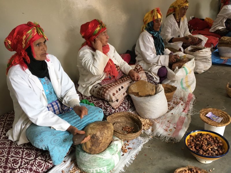 Moroccan women grinding argan seeds