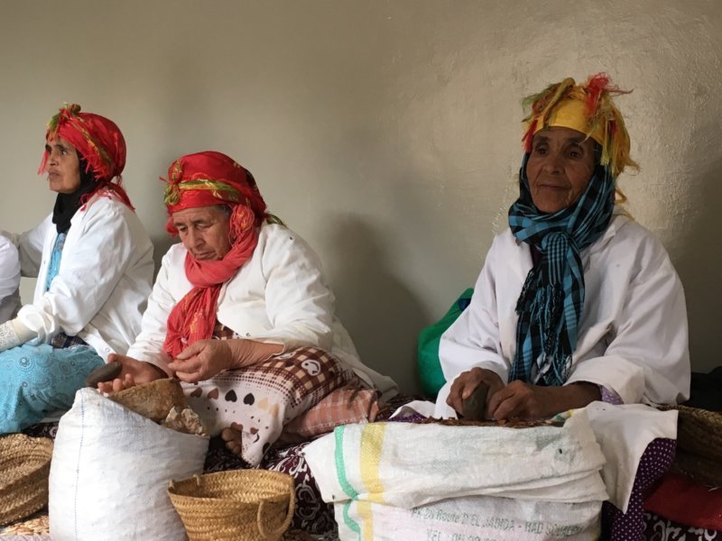 Moroccan women producing argan oil