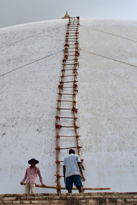 Repairing a stupa, Anuradhapura