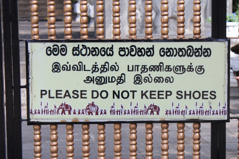 No shoes in the Temple of the Tooth Take off your shoes