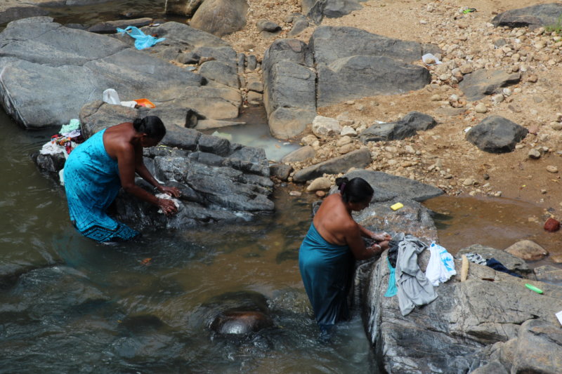 Washing laundry in river, Sri Lanka tea country
