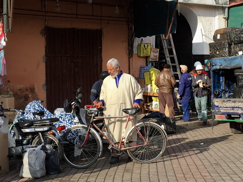 Man and his bike in the souks of Marrakech Man and his bike in the souks of Marrakech