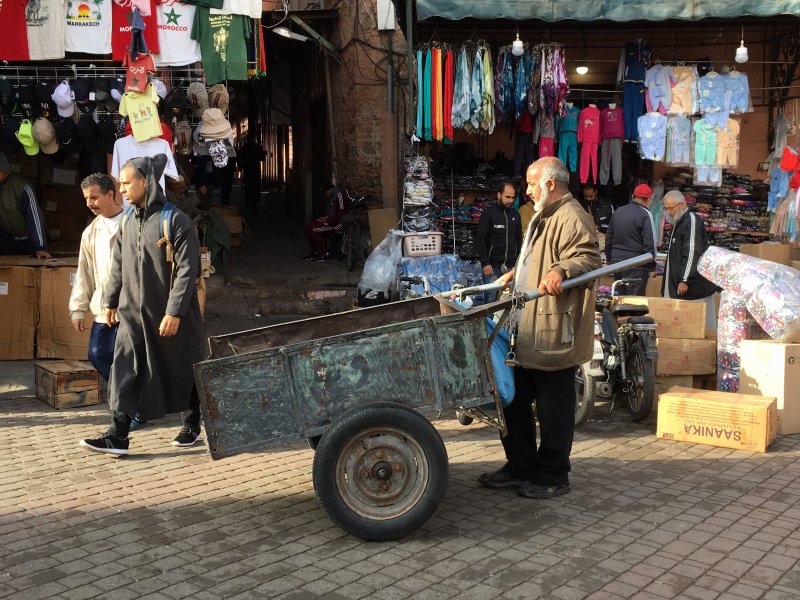 Man and his carriage Man and his carriage in the souks of Marrakech