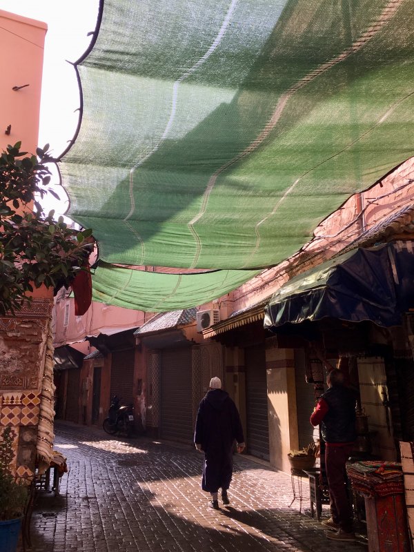 Man walking in the souks of Marrakech Man walking in the souks of Marrakech