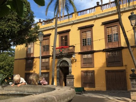 Examining an Icod de los Vinos fountain, Tenerife