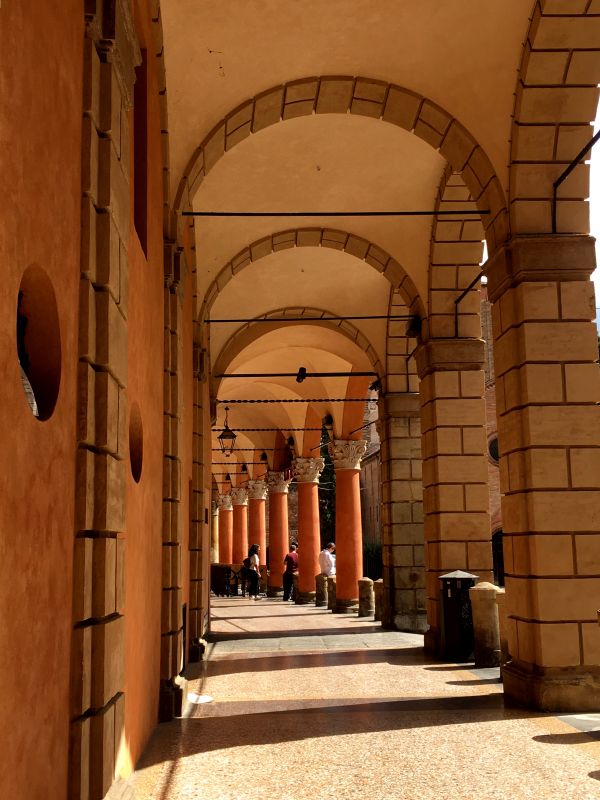 Mediterranean colors of Bologna arcades Piazza Santo Stefano portico, Bologna