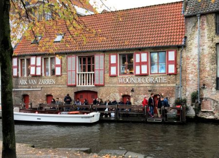 River cruising through Belgium and the Netherlands: Bruges canalside cafe