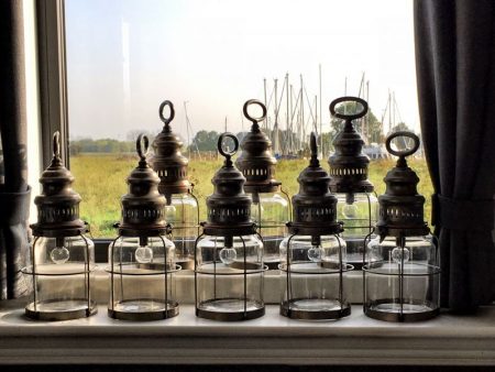 Canal cruising in Belgium and the Netherlands: lanterns on barge window