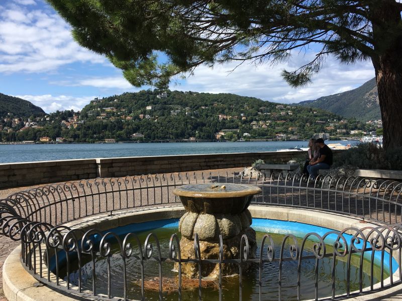 Como lakeside promenade Como fountain and lake