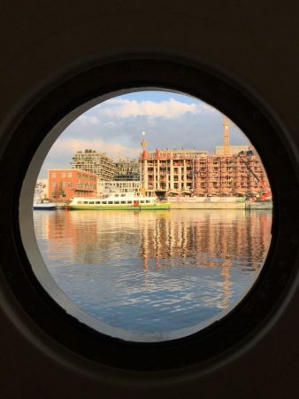 River cruising in Europe: Antwerp from barge window River cruising in Europe: Antwerp from barge window