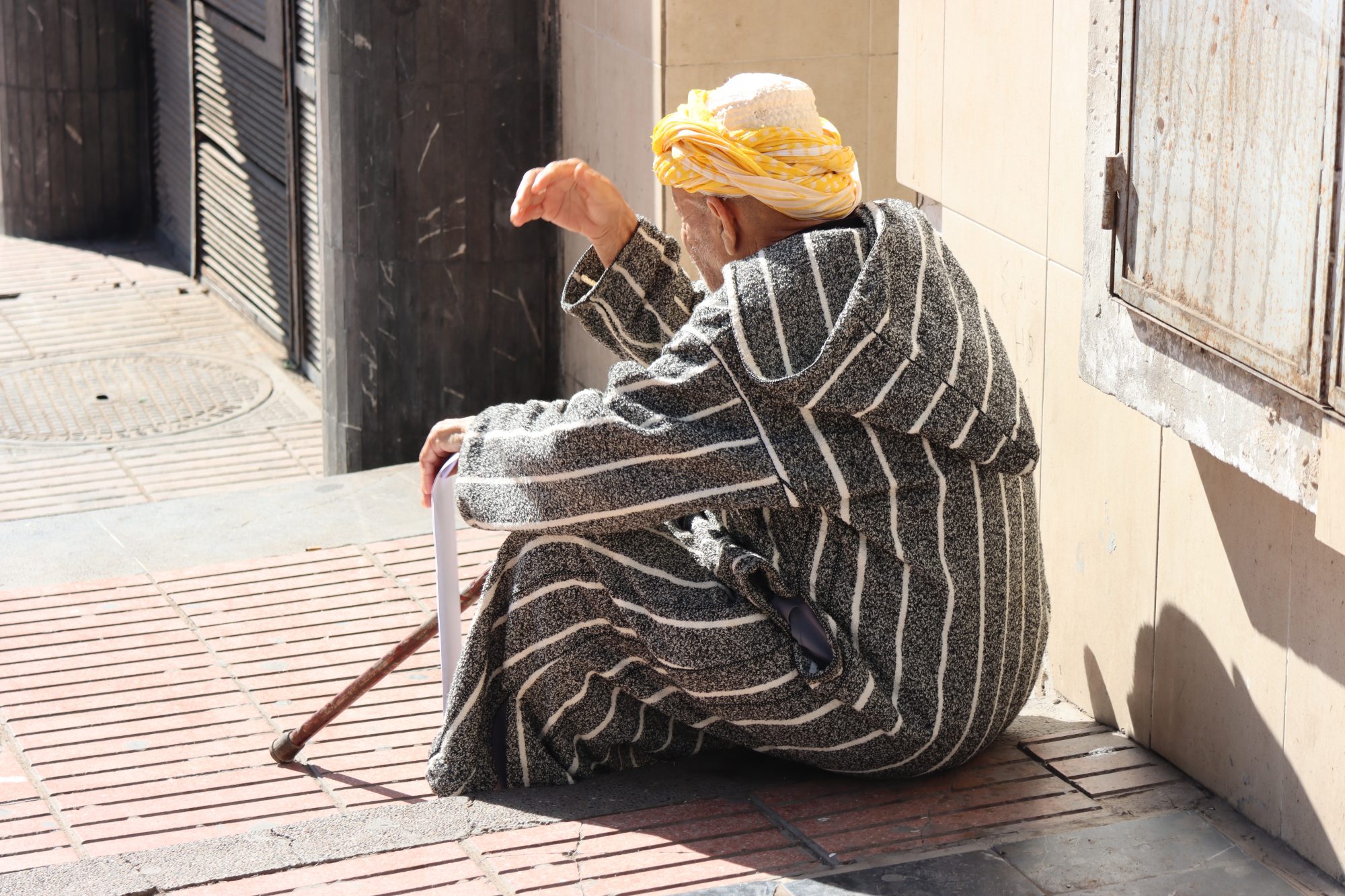 Moroccan Berber man sitting on stairs