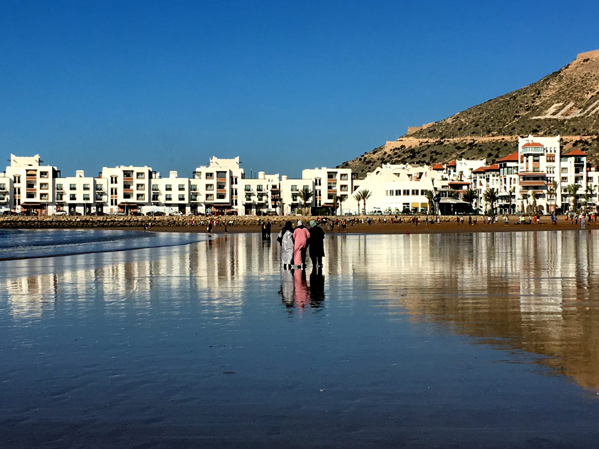 Local women walking on Agadir beach