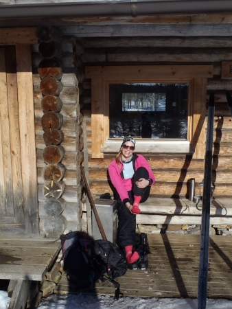 Ski tour in Lapland: sitting in front of Suomunruoktu hut