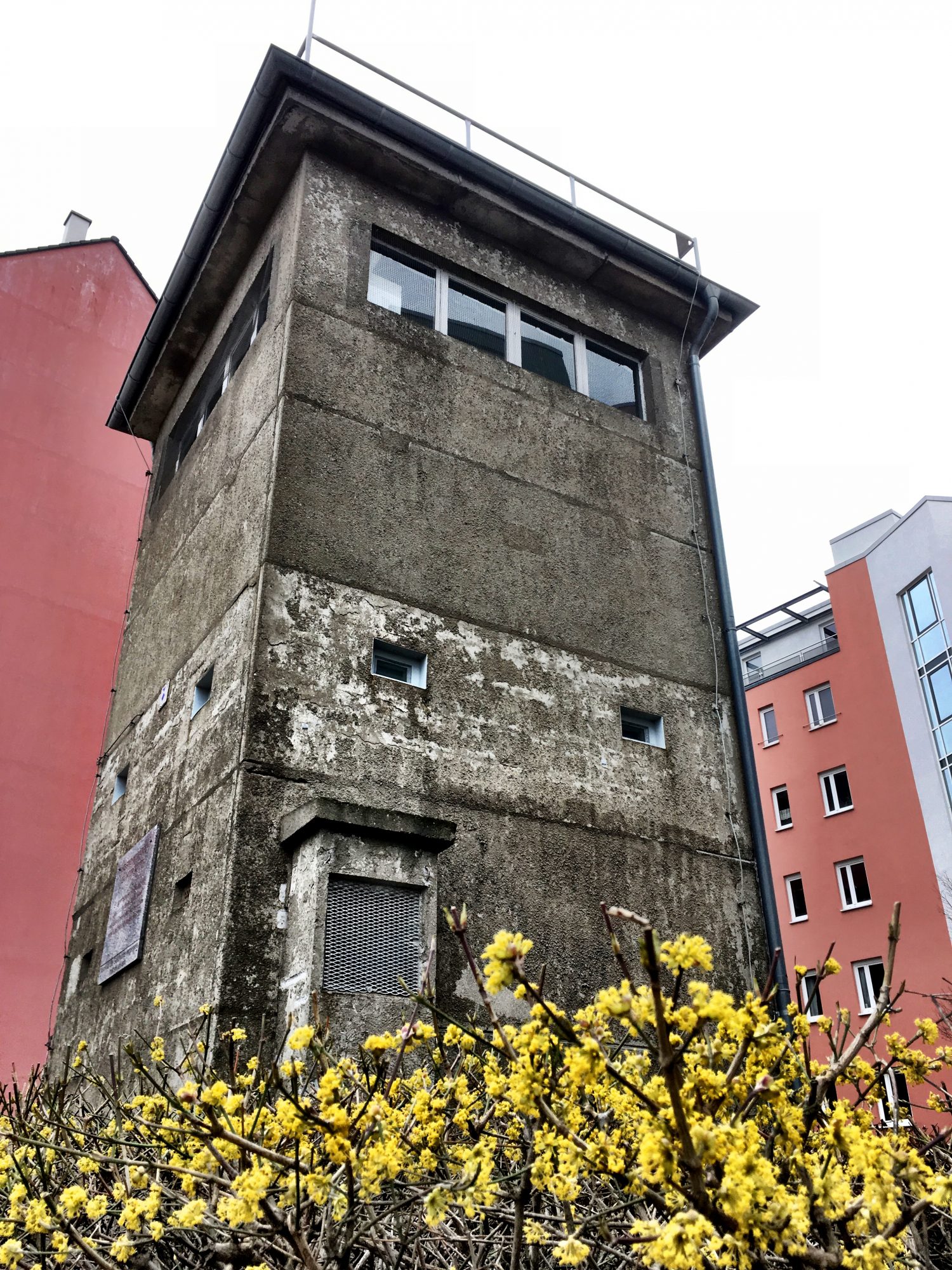 A Berlin Wall watch tower decorating a residential area Walking along the Berlin Wall, a watch tower