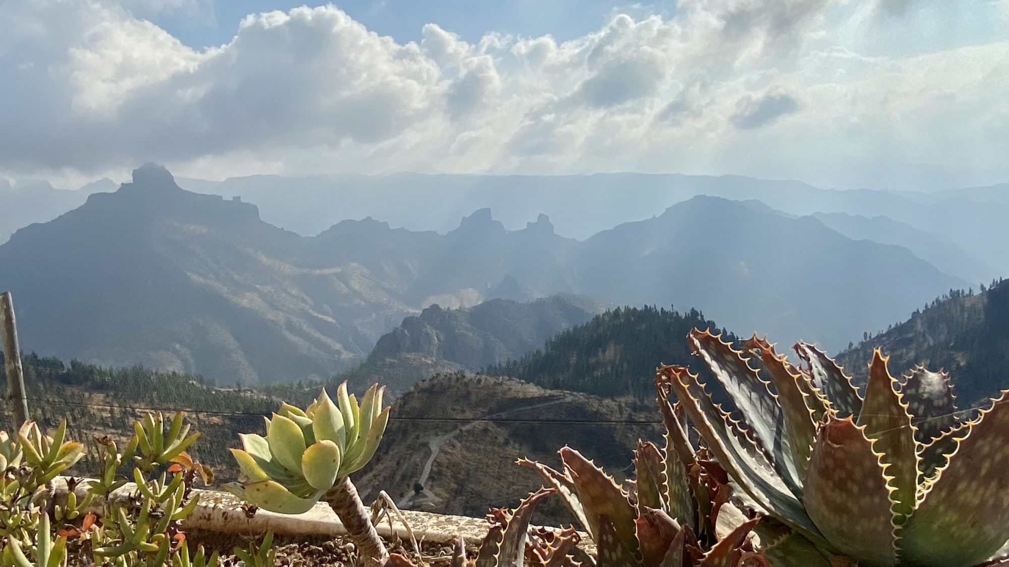 Sun and clouds, the weather elements in the Canarian mountains View from Artenara cave house village, Gran Canaria